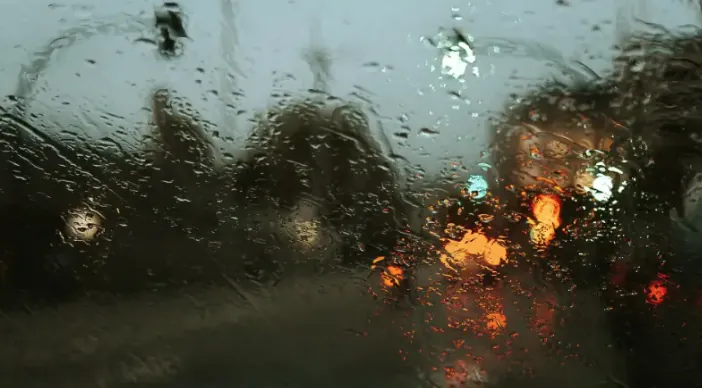 Hydrophobic ceramic windshield coating beading water on automotive glass