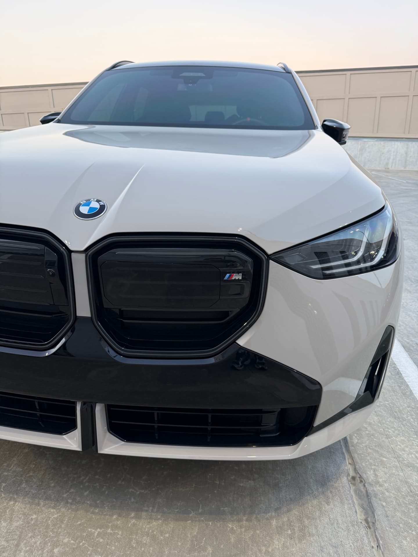 White BMW X3 M with gloss black grille after a Grandlux One Year Protection Detail with polymer paint sealant in Frisco, TX